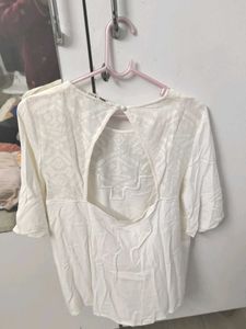 Elegant White Top With Geometric Detailing
