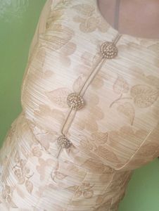 Nude Floral Gown With Cancan Styled Wit Stone Work