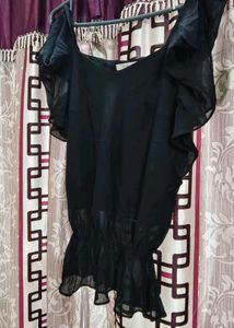 The perfect black top, elevated.