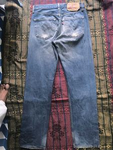 Worn Blue Denim Jeans