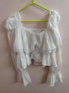 white bell bottom sleeves top.