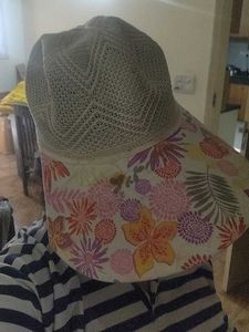 Sun Protection Cap And Black Ceramic Flower Vase
