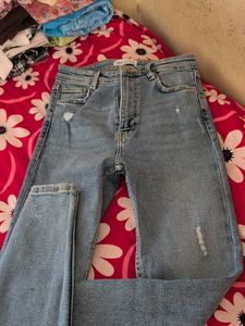 Distressed Light Wash Denim Jeans