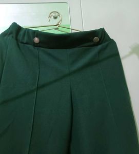 flared / bootcut dark green trousers pants