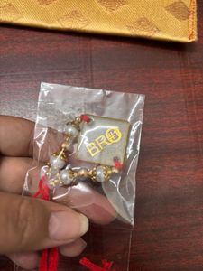 Pack Of 2 Resin Rakhi With A Money Holder