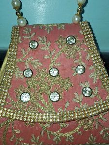 Elegant Pearl Handle Clutch