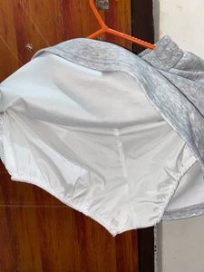 Girl&#39;s Gray Skirt with Blue Ribbon