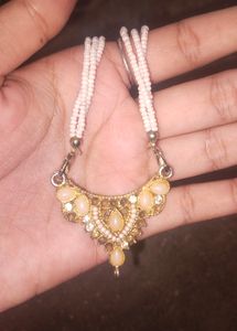 A white Long Harwm With Bracelight.