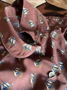 crazy button up top with a tying knot down