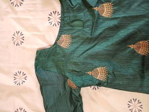Dark Green Kurta With Golden Jumka Design