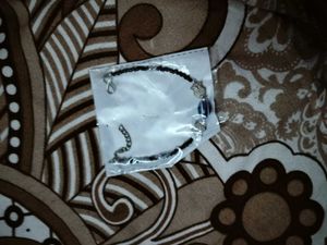 Cap Gloves Bracelet And Embroidery Wall Hanging