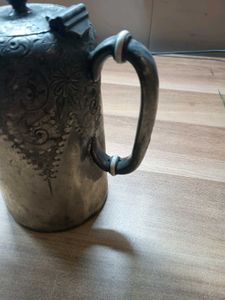 silver-plated pitcher or teapot