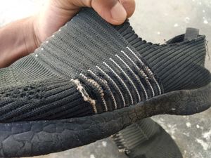 Worn Black Sneakers