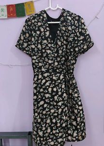 a black floral tie up dress