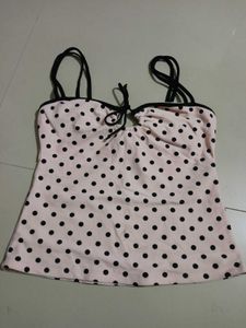 This stylish polka dot camisole top