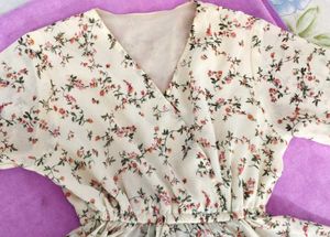 A White Floral Peplum Ruffled Top