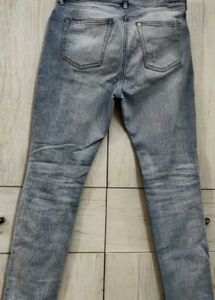 Light Blue Distressed Slim Fit Jeans.