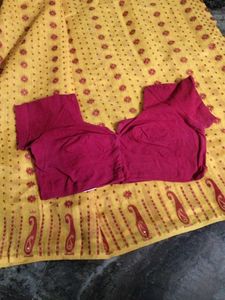 Elegant Yellow Saree with red Blouse.