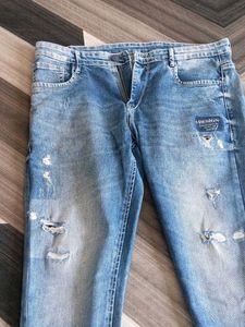 Ripped Blue Denim Jeans