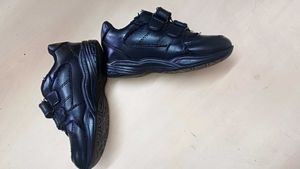 Lightly used Black Shoes for a Kid