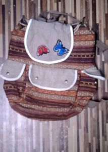 Striped Backpack with Butterfly Details