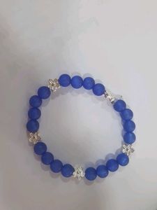 Blue Beaded Bracelet with Silver Flowers