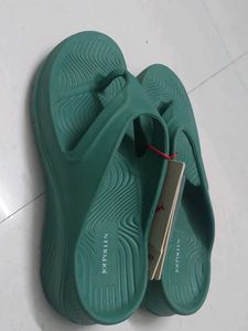 Branded Green flip-flops
