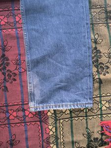 Worn Blue Denim Jeans