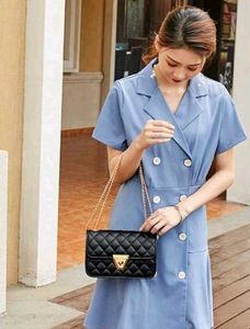 Elegant Black Sling Bag With Gold Chain