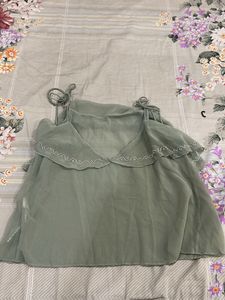 A teal sequinned top perfect for parties