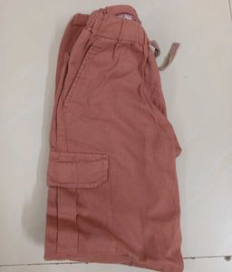 a pink cargo style joggers.