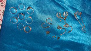 Assorted Gold Tone Earrings and Silver Rings