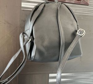 Black Mini Backpack with Pom Po