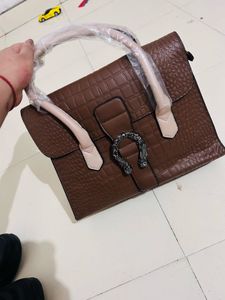brown medium handbag 👜