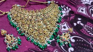 Ornate Gold Necklace with Green Beads