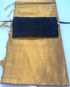 Gold Plain Sareee And Black Blouse