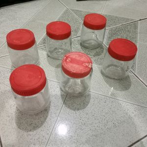 6 small size glass containers.