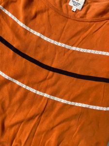 again orange broad neck top