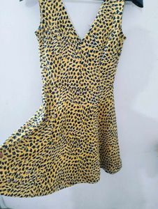 H&amp;M yellow and Black animal print skater dress.