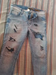 Distressed Light Wash Denim Jeans