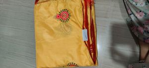 musk melon colour traditional saree with latkans and butas comes with red blouse
