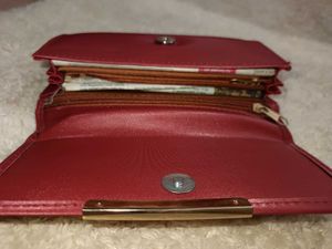 it's new Burgundy Clutch with Gold Detail