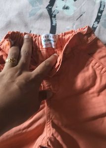 Two Boys Orange and green Shorts