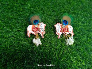 Cow Showpiece with Peacock Feather