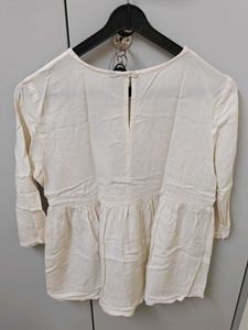 White Embroidered Peplum Top