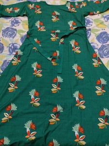 Its a Dark Green Colour Full Length Gown With Print Of Beautiful Flowers Overall In Xxl Size