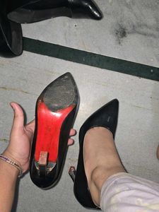 used red bottom black pointed heels