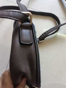 blue and dark brown sling bag
