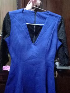 woolen top with net sleeves and back zip i used only once because it has deep neck from front and becoz of size issue