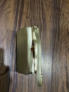Gold Hand  Bag With Removable Sling And 2 Zip Pockets Inside. One In Center And One On Side
